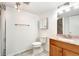 Basement bathroom with shower and updated vanity at 5769 S Nepal Ct, Centennial, CO 80015