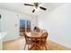 Bright dining area with wood floor and access to deck at 5769 S Nepal Ct, Centennial, CO 80015