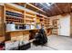 Workshop in garage with built-in shelving and workbench at 5769 S Nepal Ct, Centennial, CO 80015