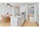 Open kitchen with island and stainless steel appliances at 5769 S Nepal Ct, Centennial, CO 80015
