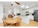 Kitchen with stainless steel appliances and breakfast nook at 5769 S Nepal Ct, Centennial, CO 80015
