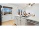 Kitchen with stainless steel appliances and deck access at 5769 S Nepal Ct, Centennial, CO 80015