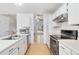 Open concept kitchen with stainless steel appliances at 5769 S Nepal Ct, Centennial, CO 80015