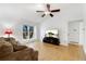 Bright living room with hardwood floors and a ceiling fan at 5769 S Nepal Ct, Centennial, CO 80015