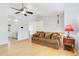 Spacious living room with hardwood floors and view to kitchen at 5769 S Nepal Ct, Centennial, CO 80015