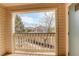 Tranquil balcony offers views of the surrounding neighborhood and mature trees at 1120 Opal St # 203, Broomfield, CO 80020