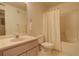 Clean bathroom features a well-maintained shower-tub combination, vanity, and neutral decor at 1120 Opal St # 203, Broomfield, CO 80020