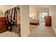 Bedroom with closet, carpet flooring, and sliding glass doors providing natural light at 1120 Opal St # 203, Broomfield, CO 80020