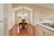 Bright dining area with natural light, hardwood floors, and a view into the kitchen at 1120 Opal St # 203, Broomfield, CO 80020