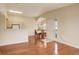 Welcoming room featuring hardwood floors, open layout, light fixtures and bright natural light at 1120 Opal St # 203, Broomfield, CO 80020