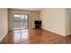 Bright living room featuring hardwood floors, a sliding glass door and neutral color palette at 1120 Opal St # 203, Broomfield, CO 80020