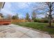 Backyard featuring green grass, concrete patio, privacy fence, and hot tub at 5716 S Lisbon Way, Centennial, CO 80015