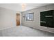 Light filled bedroom with a lush green feature wall and window view at 5716 S Lisbon Way, Centennial, CO 80015