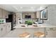 Bright kitchen with stainless steel appliances, a center island, and modern countertops at 5716 S Lisbon Way, Centennial, CO 80015
