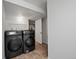 Laundry room featuring brand new washer and dryer combo at 5716 S Lisbon Way, Centennial, CO 80015