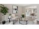 Comfortable living room leading to the dining room with stylish decor and natural light at 5716 S Lisbon Way, Centennial, CO 80015