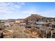 Scenic aerial view of a town with charming buildings and a majestic mountain backdrop on a beautiful sunny day at 20 Wilcox St # 517, Castle Rock, CO 80104