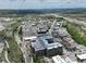 Expansive aerial shot of the building near highways, showing proximity to commercial zones and roadways at 20 Wilcox St # 517, Castle Rock, CO 80104
