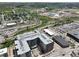 Aerial view shows the complex and surrounding landscape with a mix of residential and commercial areas at 20 Wilcox St # 517, Castle Rock, CO 80104