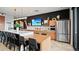 Modern common area with a long island, kitchen, dining table, stainless steel appliances and stylish decor at 20 Wilcox St # 517, Castle Rock, CO 80104