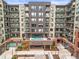 Beautiful exterior showcasing the modern architecture and inviting pool area with relaxing lounge chairs at 20 Wilcox St # 517, Castle Rock, CO 80104