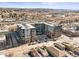 An aerial view of a modern apartment complex featuring ample parking and balconies overlooking the neighborhood at 20 Wilcox St # 517, Castle Rock, CO 80104