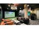 Upscale game room featuring golf simulator, comfortable seating, and stylish decor for ultimate relaxation at 20 Wilcox St # 517, Castle Rock, CO 80104