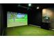 A golf simulator room showcasing turf and equipment, for recreational entertainment at 20 Wilcox St # 517, Castle Rock, CO 80104