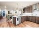 Modern kitchen with stainless steel appliances, white countertops, and hardwood floors at 20 Wilcox St # 517, Castle Rock, CO 80104