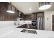 Well-appointed kitchen with stainless steel appliances, and white countertops at 20 Wilcox St # 517, Castle Rock, CO 80104