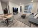 Bright living room with contemporary furnishings, a unique dining table and large windows at 20 Wilcox St # 517, Castle Rock, CO 80104