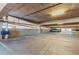 Parking garage with reserved spots, bright lighting, and high ceilings at 20 Wilcox St # 517, Castle Rock, CO 80104
