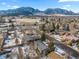 Stunning aerial view showcases the property's location with mountain views, perfect for those seeking natural beauty at 4640 Macky Way, Boulder, CO 80305