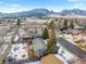 Aerial view showcasing a neighborhood with mountain views, highlighting the desirable location and community setting at 4640 Macky Way, Boulder, CO 80305