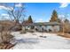 Backyard features a small patio with a table and chairs, offering an inviting space for outdoor relaxation and entertainment at 4640 Macky Way, Boulder, CO 80305