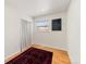 Bright bedroom with hardwood floors, a patterned rug, and a window providing natural light at 4640 Macky Way, Boulder, CO 80305