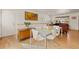 Open-concept dining area with modern table and chairs, seamlessly connected to the living room at 4640 Macky Way, Boulder, CO 80305