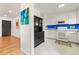 Bright kitchen with white appliances and cabinets and a view of the open living area at 4640 Macky Way, Boulder, CO 80305