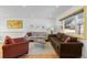 Sunlit living room featuring hardwood floors, neutral walls, and a comfortable seating arrangement at 4640 Macky Way, Boulder, CO 80305