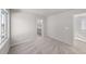Bedroom featuring neutral carpet, baseboards, and an ensuite bathroom at 7310 Watercress Dr, Littleton, CO 80125