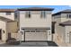 Two-story home with an attached two-car garage and neutral exterior at 7310 Watercress Dr, Littleton, CO 80125