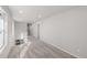 Carpeted upper hallway with ample natural light, leading to various rooms and spaces at 7310 Watercress Dr, Littleton, CO 80125