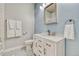 Bathroom featuring a vanity with modern fixtures, patterned floor tiles, and a coordinated color scheme at 5677 S Park Pl # B110, Greenwood Village, CO 80111