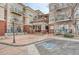 Apartment building entrance featuring handicap parking and manicured landscaping at 5677 S Park Pl # B110, Greenwood Village, CO 80111