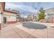 Gated community pool covered for the winter with nearby lounge seating at 5677 S Park Pl # B110, Greenwood Village, CO 80111