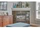 Close-up of a black marble fireplace with white mantel at 5677 S Park Pl # B110, Greenwood Village, CO 80111