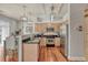 Modern kitchen with stainless steel appliances and hardwood floors at 5677 S Park Pl # B110, Greenwood Village, CO 80111