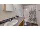 Neat bathroom featuring a sink, toilet, shower, and stylish decor at 492 Kimmes Ln, Breckenridge, CO 80424