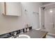 Bright bathroom features a sink, toilet, shower, and vanity mirror at 492 Kimmes Ln, Breckenridge, CO 80424