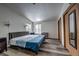 Spacious bedroom features wood floors, a double bed, and natural light from two windows at 492 Kimmes Ln, Breckenridge, CO 80424